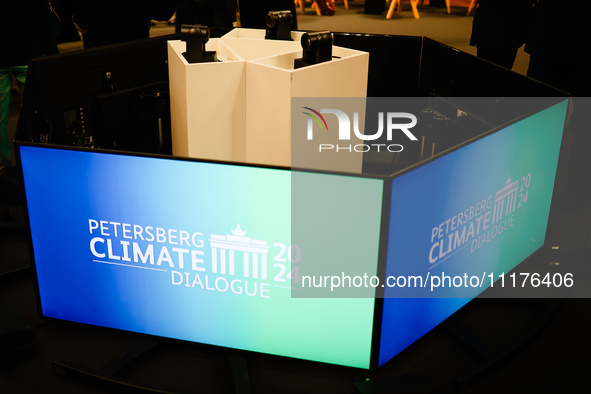 Signs are being displayed at the Petersberg Climate Dialogue 2024 in Berlin, Germany, on April 25, 2024. 