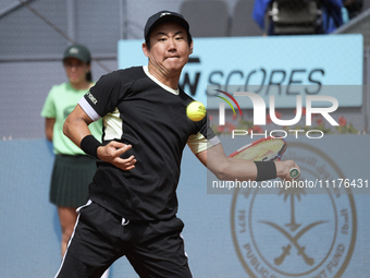 Yoshihito Nishioka of Japan is in action during the 2024 ATP Tour Madrid Open tennis tournament at Caja Magica in Madrid, Spain, on April 25...