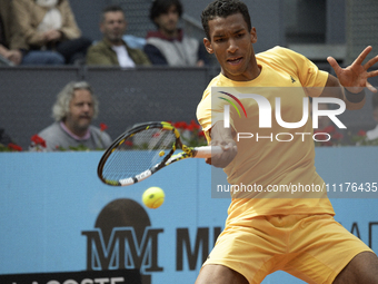 Felix Auger-Aliassime of Canada is in action during the 2024 ATP Tour Madrid Open tennis tournament at Caja Magica in Madrid, Spain, on Apri...