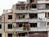 Workers are dismantling a section of the apartment building at 118 Naberezhna Peremohy Street in Dnipro, Central Ukraine, on April 25, 2024,...