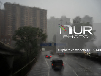 A general view shows rain falling on the motorway in Hong Kong, on April 26, 2025. (