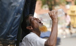 A rickshaw puller is drinking water during a heatwave in Dhaka, Bangladesh, on April 25, 2...