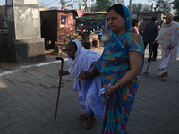 An elderly woman is arriving at a polling station to cast her vote during the second phase of the Indian General Elections in Vrindavan dist...