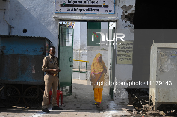 A woman is walking out after casting her vote at a polling station during the second phase of the Indian General Elections in Vrindavan dist...