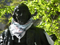 The statue of Benjamin Franklin is donning attire as protesters are setting up camp to protest the Gaza conflict on the University of Pennsy...