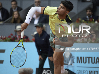 Carlos Alcaraz of Spain is in action during the 2024 ATP Tour Madrid Open tennis tournament at Caja Magica in Madrid, Spain, on April 26, 20...