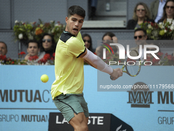 Carlos Alcaraz of Spain is in action during the 2024 ATP Tour Madrid Open tennis tournament at Caja Magica in Madrid, Spain, on April 26, 20...