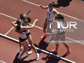 Sophia Gorriaran, Chloe Fair, Victoria Bossong, and Maia Ramsden from Harvard are celebrating after winning the College Women's Distance Med...