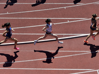 Athletes are competing in the College Women's Distance Medley Championship of America on day 2 of the 128th Penn Relays Carnival, the larges...