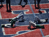 Athletes are warming up on the infield in preparation for day 2 of the 128th Penn Relays Carnival, the largest track and field meet in the U...