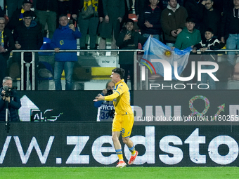 Matias Soule' of Frosinone Calcio celebrates after scoring first goal as an Argentine flag waves behind him during the Serie A TIM match bet...
