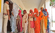 Voters are showing their ID cards as they wait to cast their votes in the second phase of...