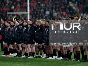 The Crusaders are standing for the national anthems during a pre-game ANZAC ceremony before the round ten Super Rugby match between the Crus...