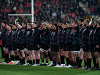 The Crusaders are standing for the national anthems during a pre-game ANZAC ceremony before the round ten Super Rugby match between the Crus...