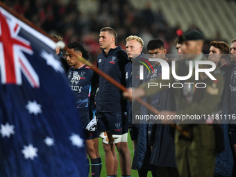 The Rebels are standing for the national anthems during a pre-game ANZAC ceremony before the round ten Super Rugby match between the Crusade...
