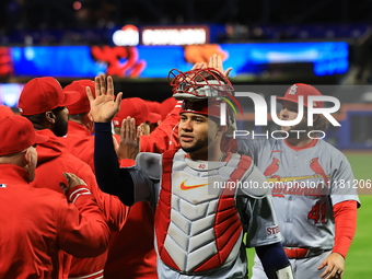 The St. Louis Cardinals are celebrating a 4-2 win in the baseball game against the New York Mets at Citi Field in New York City, N.Y., on Ap...