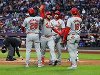 Alec Burleson #41 of the St. Louis Cardinals is being congratulated after hitting a three-run homer during the second inning of a baseball g...