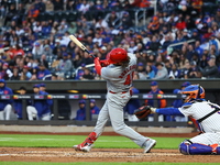 Alec Burleson #41 of the St. Louis Cardinals is hitting a three-run homer during the second inning of a baseball game against the New York M...