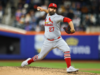St. Louis Cardinals starting pitcher Andrew Kittredge #27 is throwing during the eighth inning of a baseball game against the New York Mets...