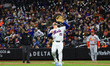 New York Mets first baseman Pete Alonso #20 is looking up for a pop fly ball during the si...