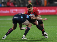 David Havili (R) of the Crusaders is being tackled by the defense of the Rebels during the round ten Super Rugby match between the Crusaders...