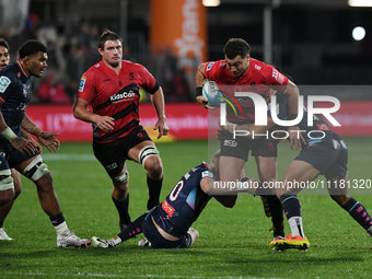 David Havili (2R) of the Crusaders is being tackled by the defense of the Rebels during the round ten Super Rugby match between the Crusader...