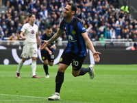 Hakan Calhanoglu of FC Inter is celebrating after scoring a goal during the Italian Serie A football match between Inter FC Internazionale a...