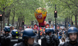 Demonstrators are standing behind the police during the annual protest marking Internation...