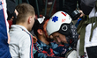 An injured demonstrator is being treated by a street medic following clashes with the poli...
