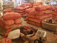 Vendors are sleeping on a hot summer day at a market in Dhaka, Bangladesh, on May 2, 2024. (