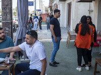 Iranian youths are enjoying time at an outdoor cafe in Bushehr, Iran's first nuclear seaport city, located in Bushehr province on the northe...