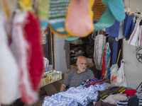 An elderly Iranian man is sitting in front of his shop at a bazaar in Bushehr, Iran, on April 28, 2024. Bushehr is Iran's first nuclear seap...