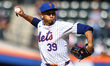 New York Mets relief pitcher Edwin Diaz #39 is throwing during the ninth inning of the bas...