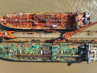 Workers are repairing ships in Zhoushan, China, on May 3, 2024. (