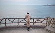 An Islamic Revolutionary Guard Corps (IRGC) military personnel is standing near a beach on...