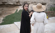 An Iranian woman is walking with her friend near a beach in Bushehr, Iran's first nuclear...