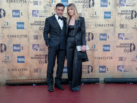 Adriano Giannini and Gaia Trussardi are attending the photocall at the 69th David Di Donatello at Cinecitta Studios in Rome, Italy, on May 3...
