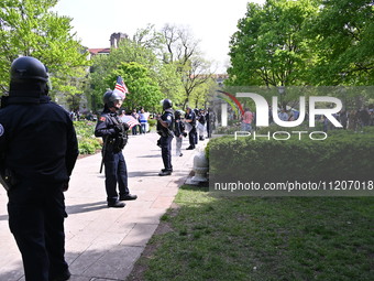 University of Chicago Police in riot gear are quelling pro-Israel and pro-Palestine protesters and forming a barrier after reports of clashe...