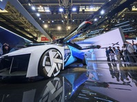 Visitors are watching the Xiaopeng AEROHT Land and Air integrated flying car at the 2024 Beijing International Automotive Exhibition in Beij...