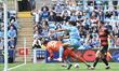 Joe Walsh of Queens Park Rangers and Ellis Simms of Coventry City are challenging for the...