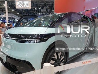 Visitors are looking at the ZEEKR MIX electric car at the 2024 Beijing International Automotive Exhibition in Beijing, China, on May 3, 2024...