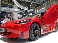 Visitors are looking at the HYPER GT electric car at the 2024 Beijing International Automotive Exhibition in Beijing, China, on May 3, 2024....