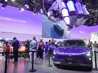 Visitors are looking at the JIDU 01 electric car at the 2024 Beijing International Automotive Exhibition in Beijing, China, on May 3, 2024....