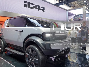 Visitors are looking at the iCAR X25 electric car at the 2024 Beijing International Automotive Exhibition in Beijing, China, on May 3, 2024....