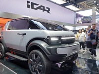 Visitors are looking at the iCAR X25 electric car at the 2024 Beijing International Automotive Exhibition in Beijing, China, on May 3, 2024....