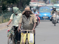 Commuters Are Seen On The Market As They Take Precaution To Beat The Heat Wave On The Hot Afternoon Time In The Eastern Indian State Odisha'...