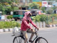 Commuters Are Seen On The Market As They Take Precaution To Beat The Heat Wave On The Hot Afternoon Time In The Eastern Indian State Odisha'...