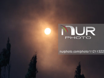 Smoke is covering the sun during a fire following a Russian missile strike in Kharkiv, northeastern Ukraine, on May 4, 2024. NO USE RUSSIA....