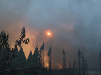 Smoke is covering the sun during a fire following a Russian missile strike in Kharkiv, northeastern Ukraine, on May 4, 2024. NO USE RUSSIA....