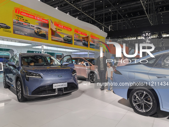 Visitors are viewing the Aion Auto exhibition area at the 21st Anhui International Automobile Exhibition in Hefei, Anhui Province, China, on...